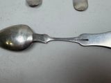 a spoon and a spoon rest on a table