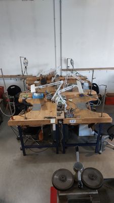 many machines that are sitting on a table in a room