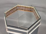 a glass table with a glass top and a metal base