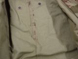 a close up of a person ' s jacket with buttons on it