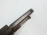 an old gun that is laying on the table