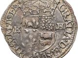 une pièce d'argent surmontée d'une couronne