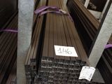 many piles of steel bars stacked on top of each other