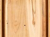 a close up of a wooden box with a hole in it
