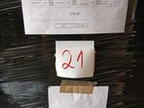 two pieces of paper taped to the side of a refrigerator