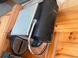 a laptop and a cell phone sitting on a wooden table