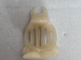 a picture of a plastic comb on a white surface