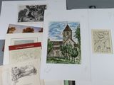 many different pictures of a church on a table