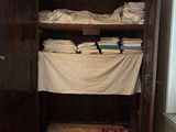 a closet with a lot of folded towels in it