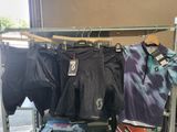 a rack of clothing that is on display in a store