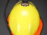 a yellow fire hydrant with a black cord attached to it