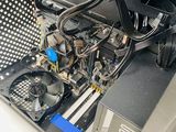 a close up of a computer case with a fan and some wires