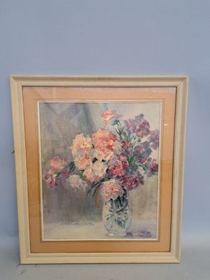 painting of flowers in a vase on a table in front of a blue wall