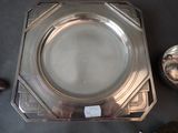 a silver plate that is sitting on a table