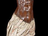 statue of jesus on the cross on a black background