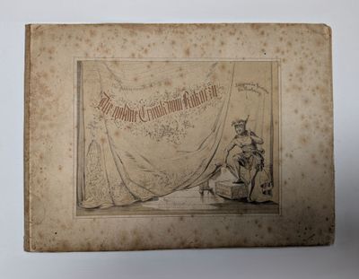 un vieux livre sur lequel figure le dessin d'un homme assis sur une chaise