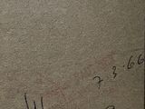 someone is writing on a piece of paper with a pen