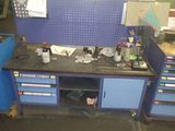 a workbench with a lot of tools on it
