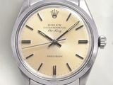 an image of a rolex watch with a yellow dial