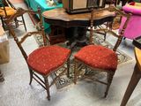 two chairs and a table in a room full of furniture