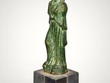 an image of a statue of a woman holding a bowl on top of her head