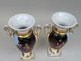 two vases that are sitting on a white table