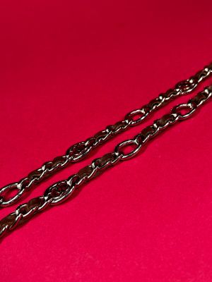 two chains on a red surface with a red background