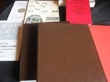 several books are sitting on a table with a black table cloth