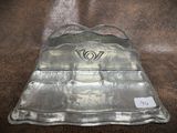 a metal tray that has a handle on it