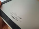 a person holding a tablet with a barcode on it