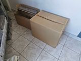 two boxes that are sitting on the floor next to each other