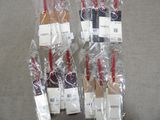 four wine bottles wrapped in plastic bags on a table