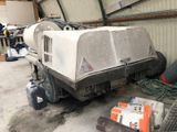 a machine that is sitting on the ground in a garage