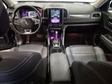 a picture of a car interior with a steering wheel and dashboard