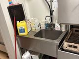 a small kitchen with a sink and a dishwasher