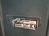 a close up of an electrical panel with a sign on it
