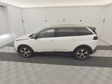 a picture of a white suv parked in a garage