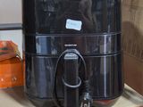 a large black container sitting on top of a shelf