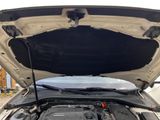 the engine of a car with its hood open and the hood up