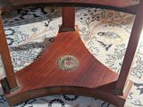 a wooden table with a metal plate on top of it