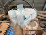 a pile of assorted items sitting on top of a pile of cardboard