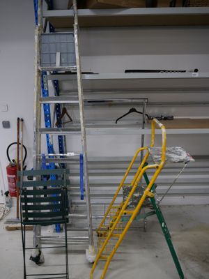 a ladder that is leaning against a wall in a garage