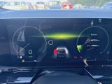 the dashboard of a car with a digital display on it