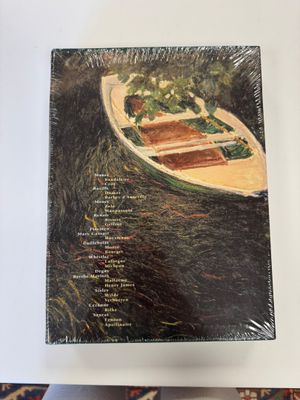 a picture of a painting of a boat on a table