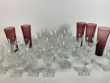 a lot of wine glasses that are sitting on a table