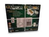 the box is open to show the contents of a home alarm