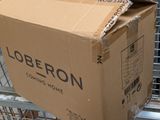 a cardboard box sitting on top of a shopping cart