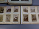 several old photographs of people are displayed on a table