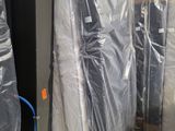 several pieces of furniture are wrapped up in plastic and ready to be shipped
