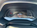 the dashboard of a car with a speedometer and a digital display